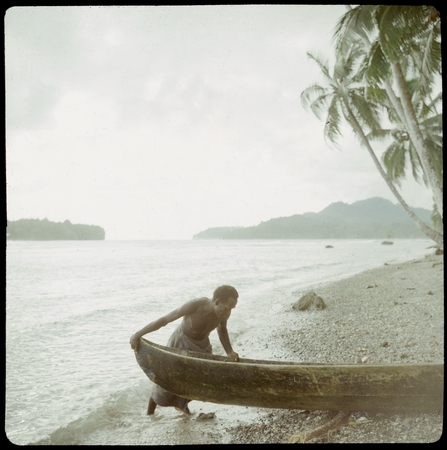 Man with boat at beach