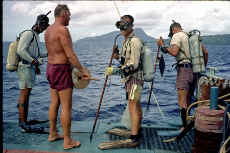 George Hohnhaus (in red shorts) on ship with scuba divers near Truk, Micronesia, during the Carmarsel Expedition