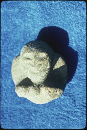 Stone carving with face
