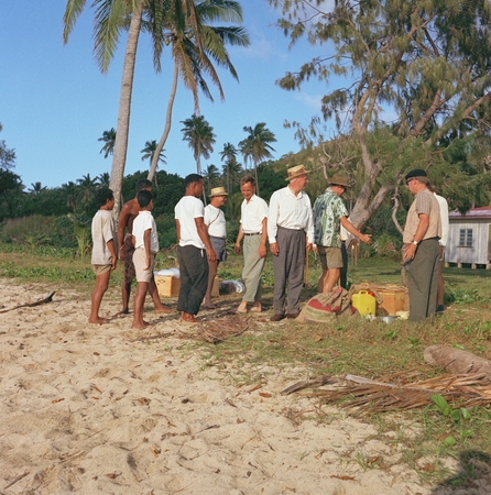 Shore Party at the Exploring Islands. Walter Munk (in middle, barefoot in sandals, white shirt, tan pants); Edward Crisp B...