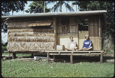 Edwin and Dona Hutchins sit on veranda of their house in Tukwaukwa village on Kiriwina