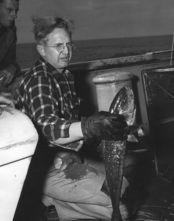 John Dove Isaacs holding a sablefish