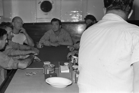 [Men playing cards in R/V Spencer F. Baird mess]