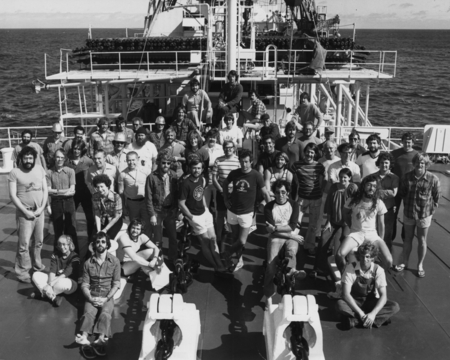 The international crew of Leg 74 of the Deep Sea Drilling Project on the deck of the research vessel D/V Glomar Challenger...