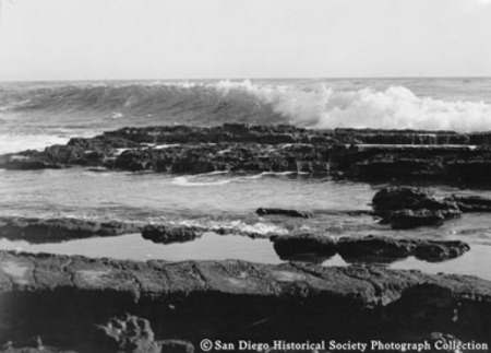 Ocean waves crashing on to rocky coast at La Jolla