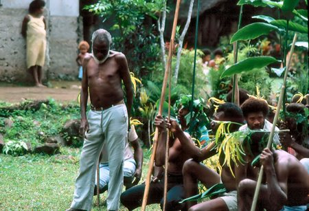 Simon Tari and dancers resting