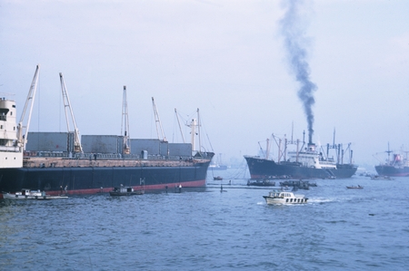 Freighters at anchor as Argo enters Tokyo Harbor