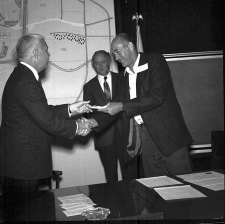Chancellor William J. McGill presenting a service award to Charles S. Fleming