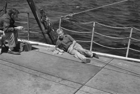[Men on deck of R/V Spencer F. Baird throwing a TNT charge for seismic profiling]
