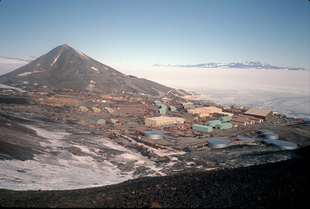 McMurdo Station, Ross Island, Antarctica, with Observation Hill at left, and Antarctic mainland in distance at right