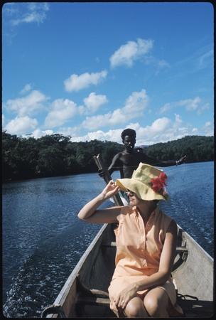 Anne Scheffler with Solomon islander on a canoe