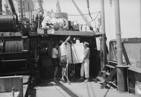 [Men with oceanographic instrument aboard R/V HORIZON]