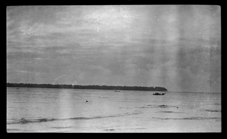 Distant view of people in canoe