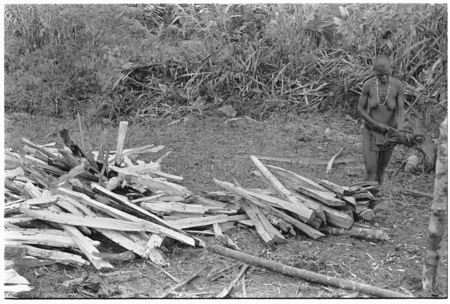 Woman chopping firewood