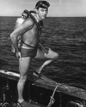 Robert Livingston, with Aqualung, prepares to go over the side on the last dive of the Capricorn Expedition