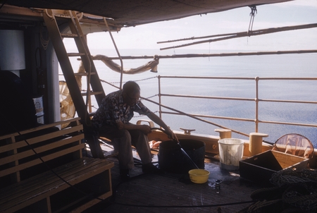 Anton Bruun getting ready to chloroform snakes, Naga Expedition, onboard R/V Stranger, December 1960