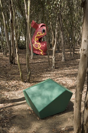 Red Shoe: shoe amongst trees and green gem in foreground