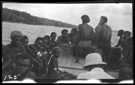 Group of people on small boat, in Graciosa bay, Santa Cruz Islands