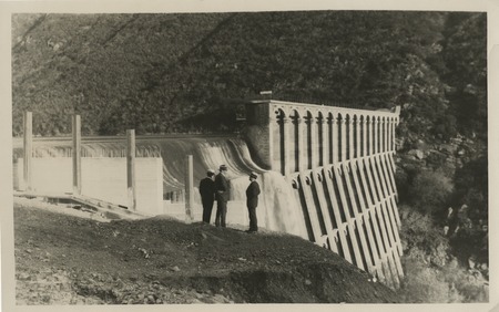 Unidentified men surveying the construction of Lake Hodges Dam