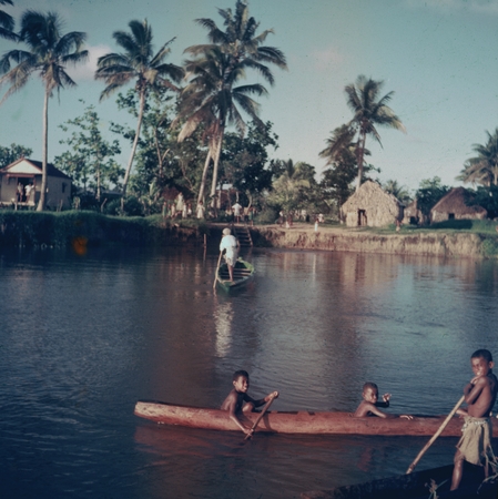 Fijian children in canoes