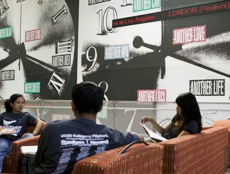 Another: view of students seated on upper platform in front of &quot;clocks&quot;