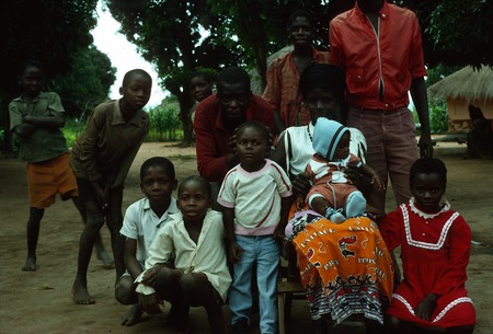Ms. Falace Mwenya with her children and neighbors