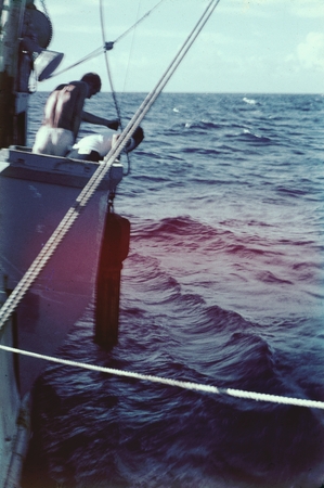 Arthur Eugene Maxwell, and others, deploying a oceanographic instrument off the fantail of the R/V Horizon during the MidP...