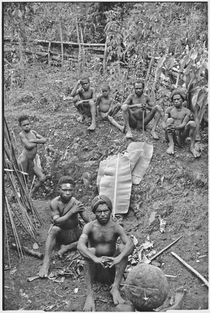 Dispute in Tuguma: men, including luluai, discuss garden damage done by neighboring group&#39;s pig