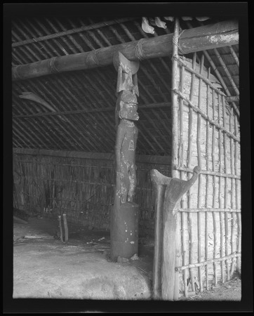 Canoe house on Makira, with carved corner post