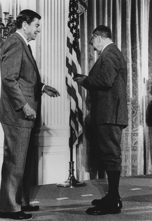 Walter H. Munk (right) receiving the National Medal for Science from Ronald Reagan