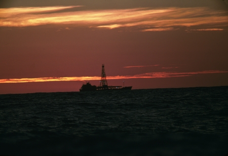 [D/V Glomar Challenger at sea at sunset]