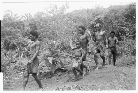 Returning to the clearing after ritual washing and &#39;uinga; the young men will go straight to the taualea shelter for berit...