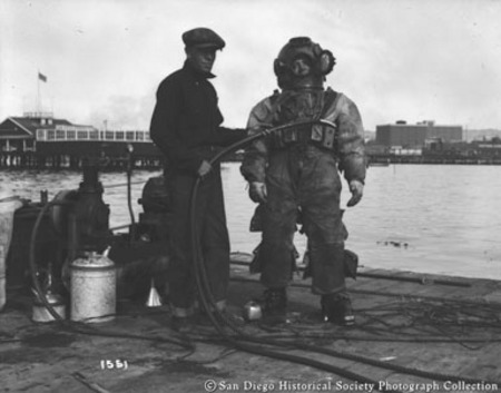 Hercules Powder Company kelp diver and another man standing on dock