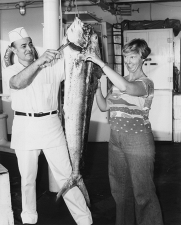 Yeo-person Gayle Burns (administrative assistant) with First Cook Zeke Ruvalcaba aboard D/V Glomar Challenger (ship) as he...
