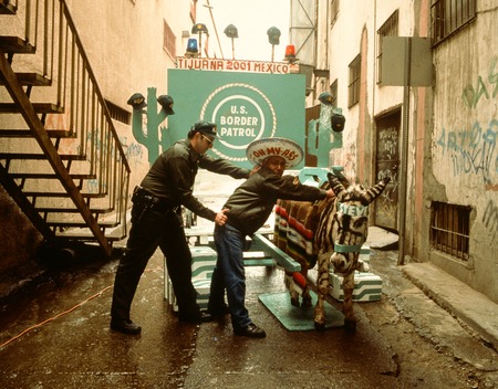 Avenida Revolución: &quot;Street vendor&quot; under arrest by &quot;border patrol agent&quot; (Meyer Vaisman)