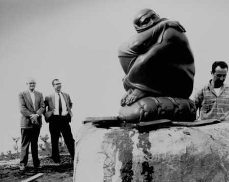 Cecil H. Green (left) and Walter Munk (hands on his hips) watch installation of Spring Stirring sculpture at Scripps Insti...