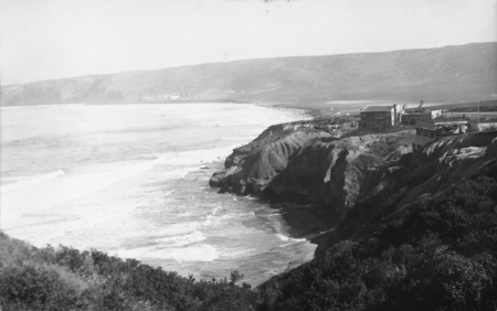 Postcard featuring the cliffs and some buildings in La Jolla, California, as well as the view of the coastline. Circa 1915.
