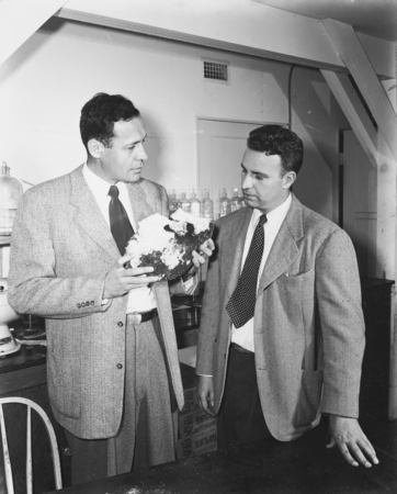 Roger Revelle and Robert Dietz, co-chief scientists on the MidPac Expedition of 1950, discussing significance of lithified...