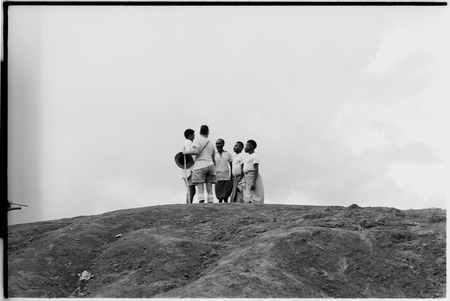Pete Vayda with men at top of hill