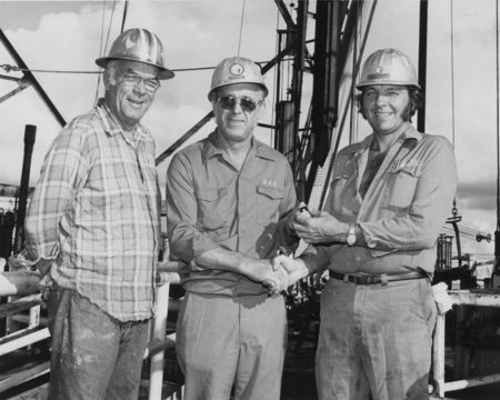 Jim Ruddell (center), the drilling supervisor aboard the D/V Glomar Challenger (ship) during the Deep Sea Drilling Project...