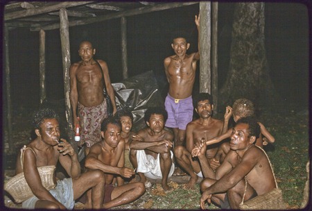 Social interaction: village chief Murebodema and other men visiting and smoking cigarettes