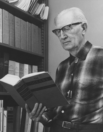 Martin W. Johnson with treatise he co-authored: The Oceans: Their Physics, Chemistry and General Biology. April 2, 1970