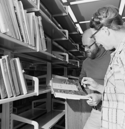 Elizabeth Shor and librarian William J. Goff in the Hubbs Library, Marine Biology Building, preparing for its move to the ...