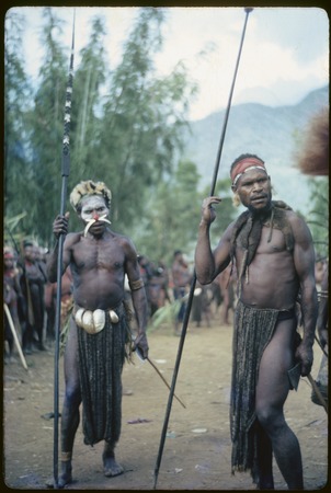 Pig festival, pig sacrifice, Kwiop: war allies Yagaina and another man wait to be called to ritual fence to be fed