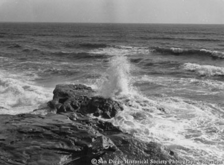 Ocean waves crashing on to rocky coast