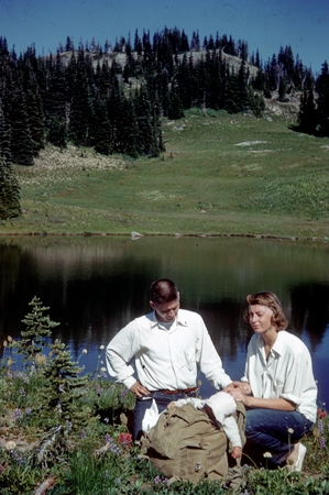Charles D. Keeling in the Sierra Nevadas with his wife, Louise Keeling and one of their babies asleep in the backpack