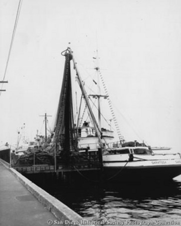 Loading nets on to tuna boat Saratoga