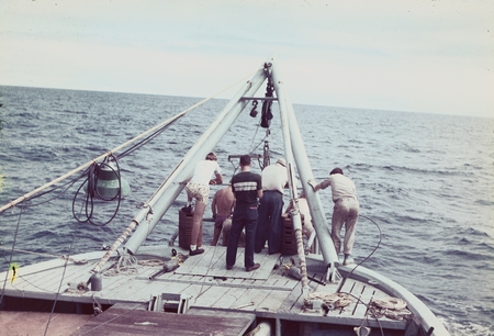 Deploying an oceanographic instrument in the Pacific waters off the R/V Horizon during the MidPac expedition. 1950.