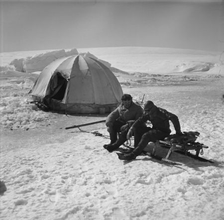 Mikhail V. Propp (left) and Eugene N. Gruzov (right) at rest on the sledge near polar tent