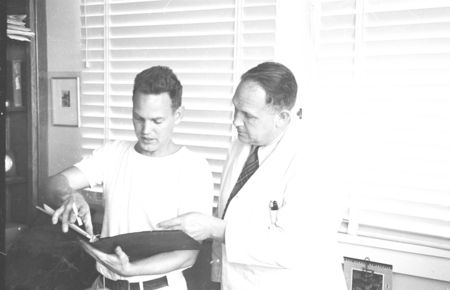Unidentified man and Denis Llewellyn Fox in office at Scripps Institution of Oceanography, circa 1947